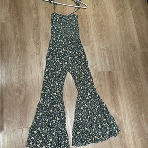 Green floral jumpsuit fitted at the top with a bell bottom leg.